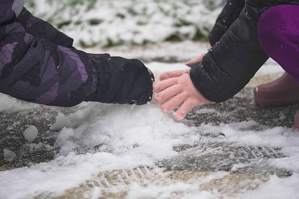 Handprints in the snow. Family fingerprints in the snow close-up and copy space.
