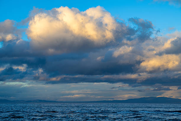Sunset with dynamic clouds in late autumn, Qualicum Beach, British Columbia, Canada