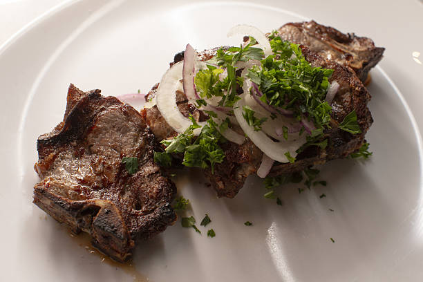 Gourmet grilled steak served with fragrant herbs and crispy onions