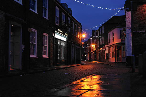 istock cobbled street lit up during christmas 2250775653
