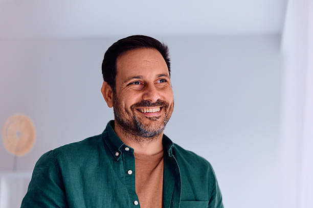 istock Smiling mid adult man looking away with confident expression 2250776797