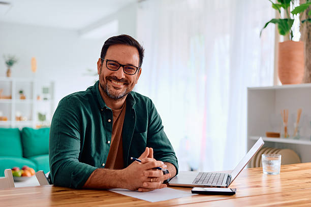 istock Happy man smiling working from home office 2250776936