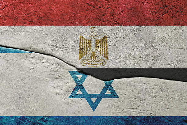istock Egypt and Israel flags separated by cracked wall showing conflict 2250777345
