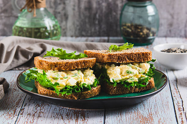 istock Savory egg salad sandwich with avocado on whole grain bread on a plate 2250779356