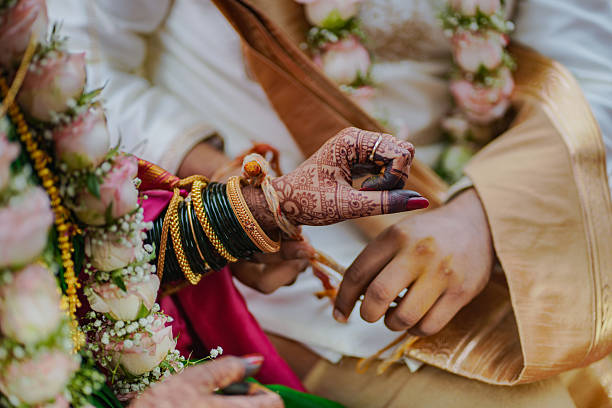 istock Traditional Indian bride and groom holding hands during wedding ritual 2250781269