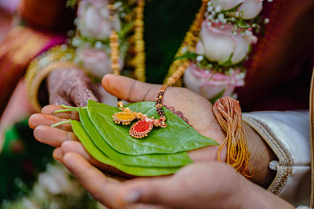 istock Indian Mangalsutra Pendant Displayed on Fresh Betel Leaves 2250781334
