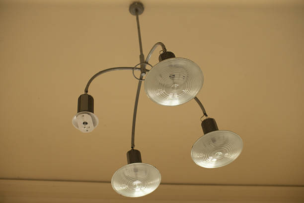 istock Industrial style chandelier with circular glass elements for interiors 2250784558