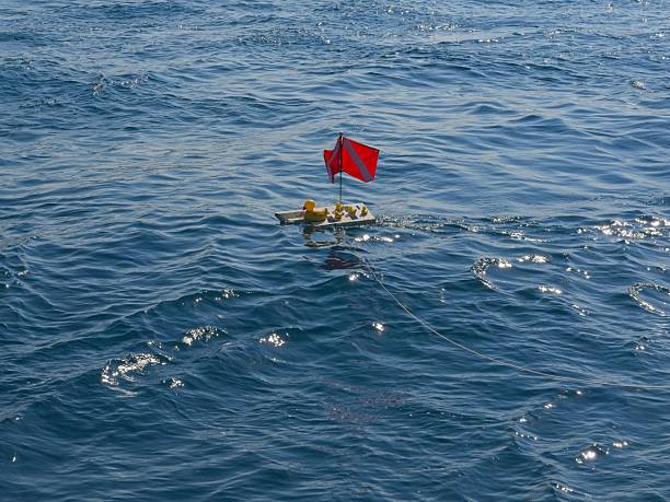 Dive flag floats on surface of the Saint Clair river that feeds into Lake Huron.