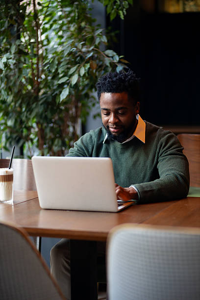 istock Young man studying with laptop in a restaurant 2250789021