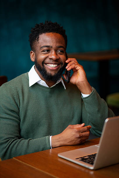 istock Young man smiling during phone conversation 2250789150