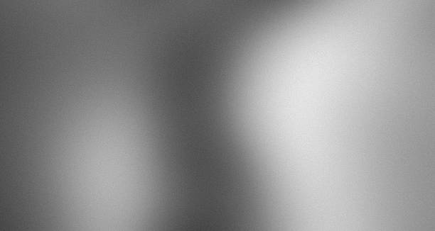 istock Noisy gradient gray grainy matte pearl silver foil abstract blurred metallic monochrome background with blank space 2250794577