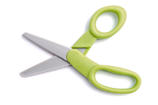 istock Pair of green handled scissors with grey blades on a white background 2250799882