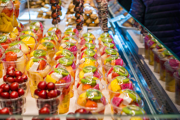 istock fresh fruit salad cups healthy convenience snack pre cut tropical fruit arranged in rows on refrigerated market display street food concept of diet eating gourmet travel 2250806371