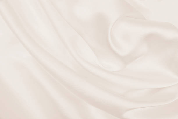 istock Smooth elegant golden silk or satin luxury cloth texture as wedding background. Luxurious background design. In Sepia toned. Retro style 2250808694