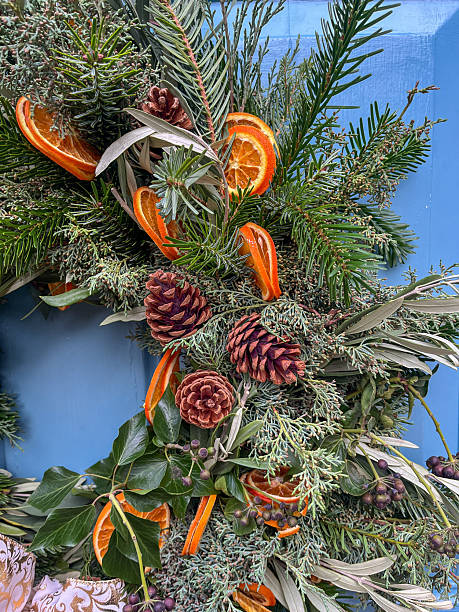 istock Festive Christmas Wreath with Greenery and Citrus Accents 2250808889