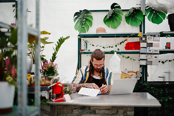 istock Man Working in Flower Greenhouse 2250809785