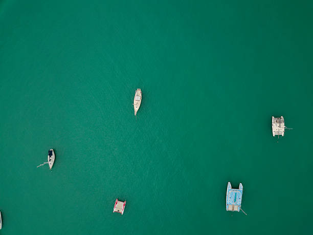 Bali, Indonesia - May 12, 2024: Sammer Harbour Serangan with yachts, boats, seawater and coastline aerial view