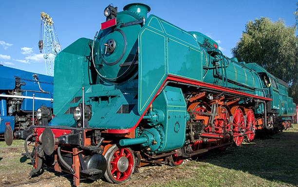 istock An impressive turquoise steam locomotive with bright red wheels 2250812021