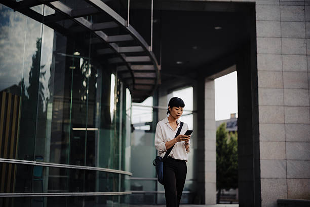 istock Japanese Businesswoman Using Smartphone While Commuting to Work 2250814936