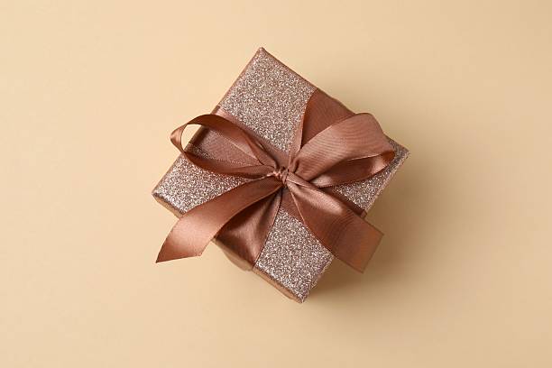 istock Beautiful gift box with festive bow on color background 2250815002