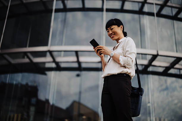 istock Japanese Businesswoman Using Smartphone While Commuting to Work 2250815188