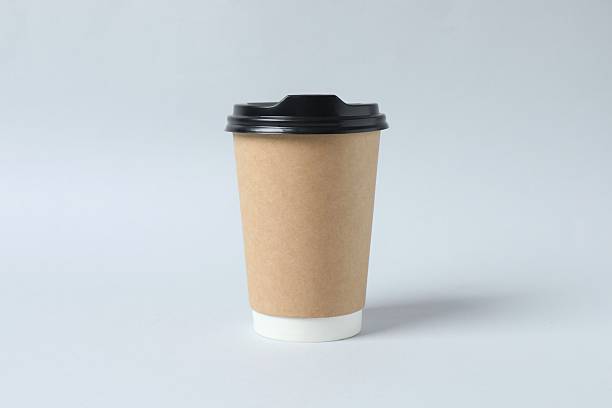 istock Paper cup of coffee on gray background 2250815336