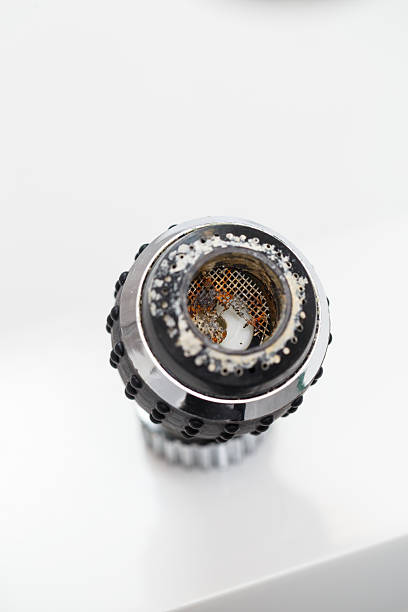 istock Old faucet aerator close-up on a white background. Broken sink mixer 2250815389