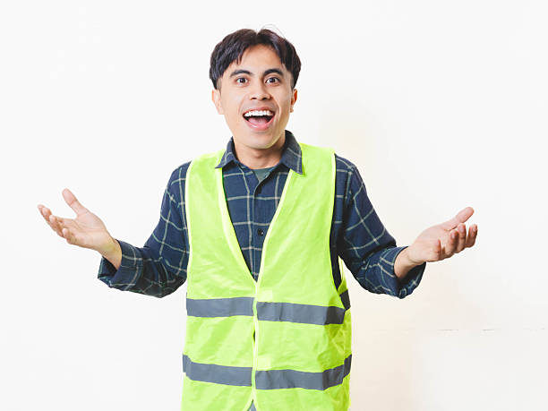 istock A construction worker in a safety vest reacting with a happy shocked expression against a white background, showing excitement and surprise. 2250817691