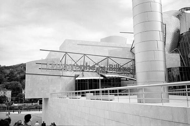 Bilbao, Spain - May 10, 1998: People looking at the newly opened Guggenheim Museum of modern and contemporary art designed by architect Frank Gehry