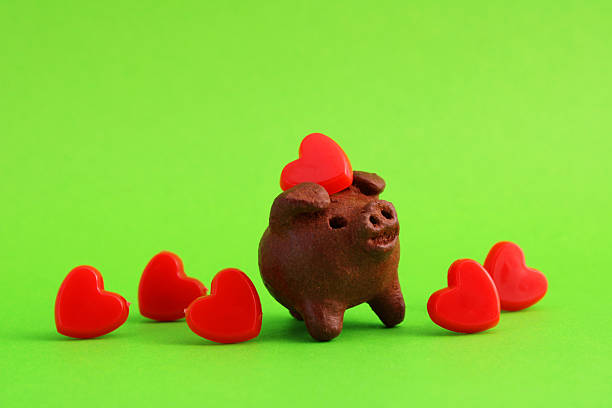 Piggy banks as a couple in love. 3D rendering isolated on white background