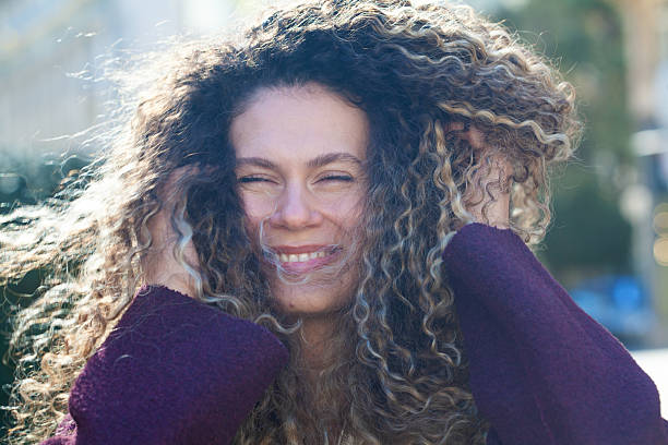 Young woman tossing hair