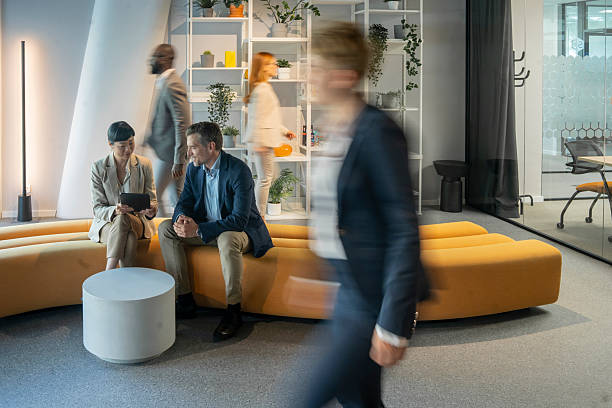 istock Business people working in modern office lobby using digital tablet 2250833899