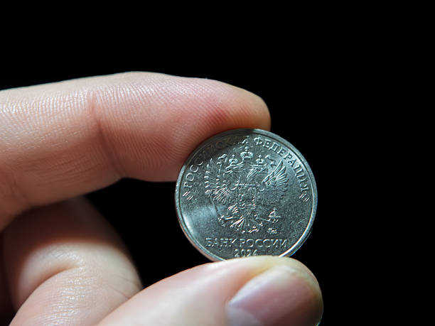 istock Russian Five Kopecks Coin Held in Hand 2250835517