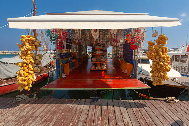 Floating market stall selling natural sponges and seashells in Rhodes, Greece