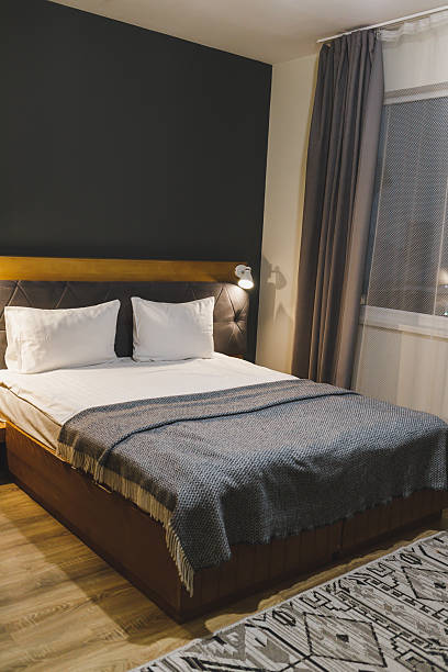 istock A bed with white pillows and a made-up bed in a hotel. Clean bed. 2250837971