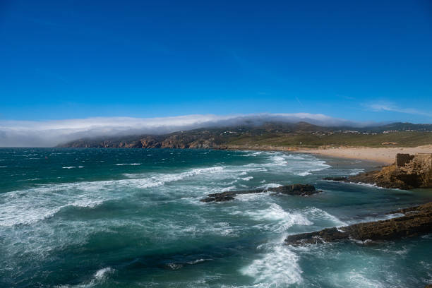 View of the scenic Guincho Beach (Praia do Guincho), in the sea, near Cascais, in Portugal