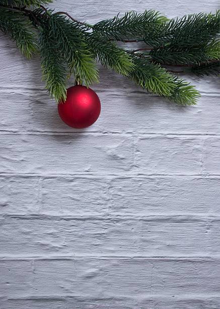 istock Red Christmas Ornament on Pine Branch 2250842240
