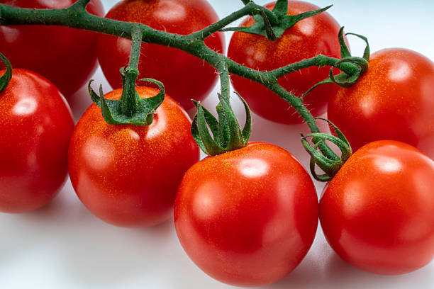 Fresh Bunch of Red Cherry tomatoes on white background, Red Cherry tomatoes bouquet on a White Background.