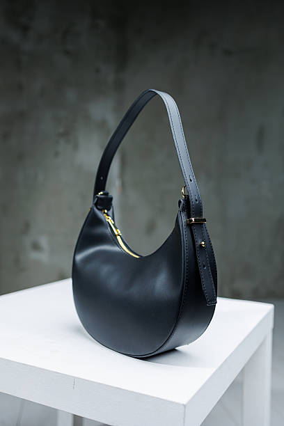 istock Handmade black leather bag on one shoulder. Women's evening bag 2250847063