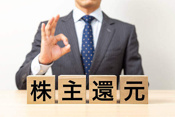 istock A businessman making an OK pose with a block that says 