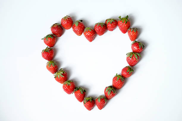 istock Strawberry in heart shape isolated on white background 2250854357