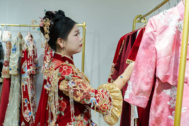istock A Chinese bride is choosing her wedding dress. 2250858478