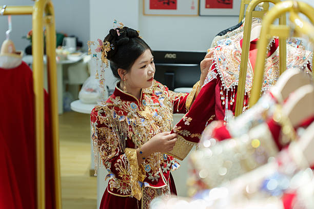 istock A Chinese bride is choosing her wedding dress. 2250858586