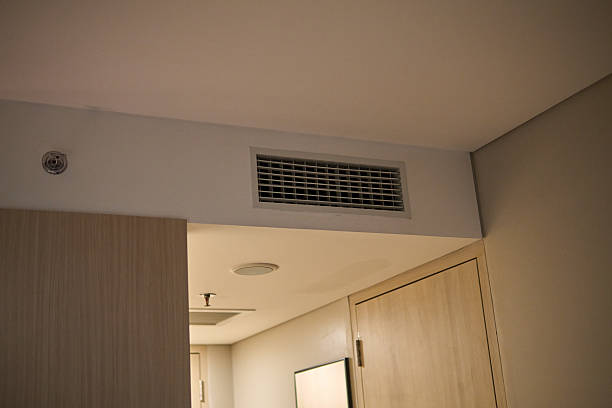 istock Ceiling air vent and HVAC duct in hotel room interior 2250861015