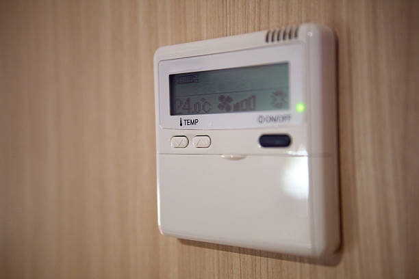 istock Close-Up of Digital Wall Thermostat with Temperature Controls 2250861134