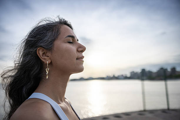istock Hopeful woman portrait wit sunset background. 2250862792
