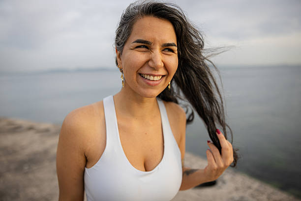 istock Hopeful woman portrait wit sunset background. 2250862863