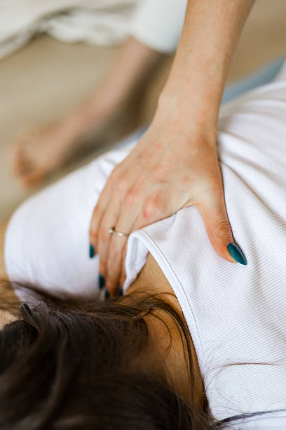 istock Hands on Iyengar yoga adjustment focusing on upper back alignment and relaxation 2250864916