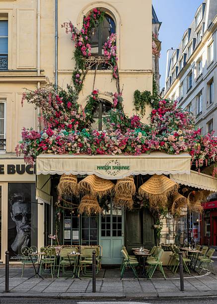 Paris, France - December 28, 2012: Le Sainsev Bar Brasserie Restaurant Entrance, Paris. Menu displayed outdoors, window display is decorated for Christmas and New Year celebration.