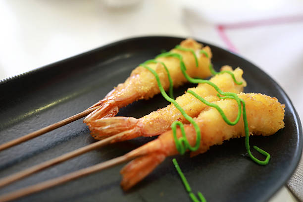 An appetizing dish of Prawns in Spicy Sauce (Chili and Peppers sauce), typical of traditional Chinese cuisine. Image in high definition quality.